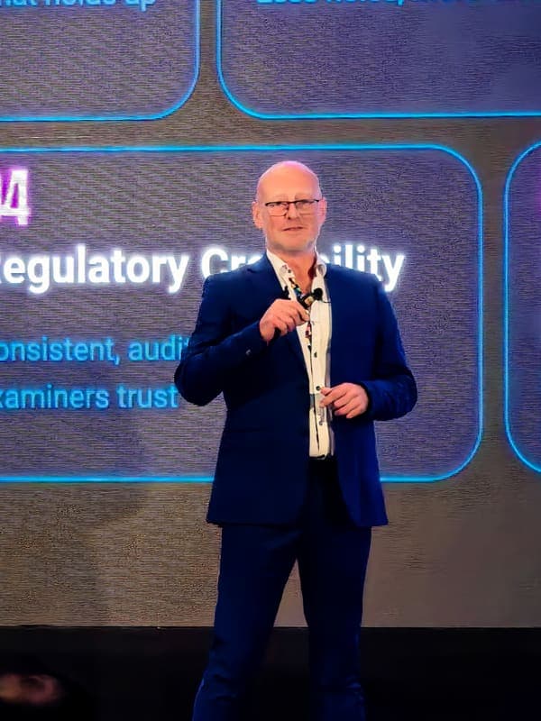 Andy Jarvis on stage with the Digital King book cover displayed