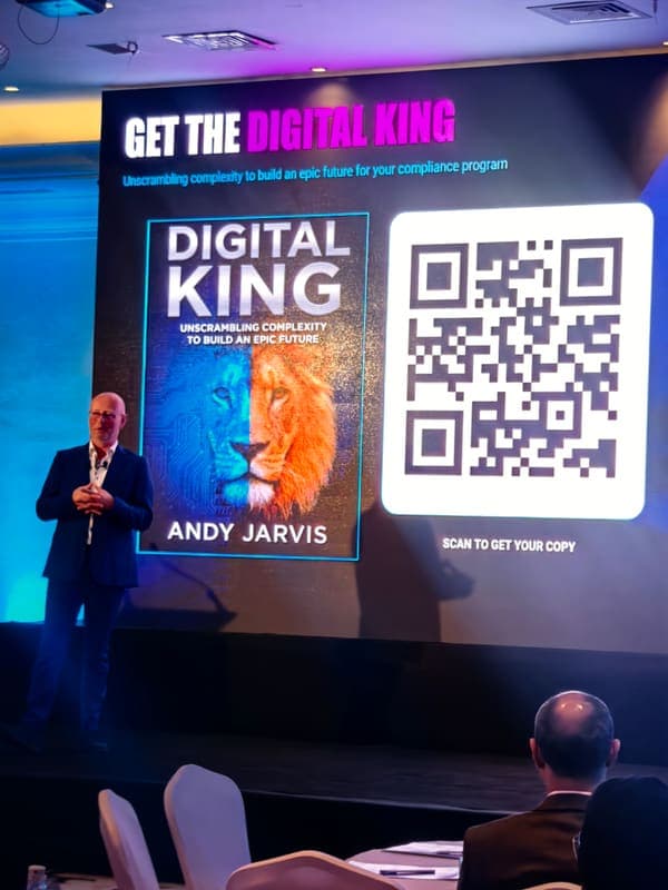 Andy Jarvis on stage with the Digital King book and QR code displayed
